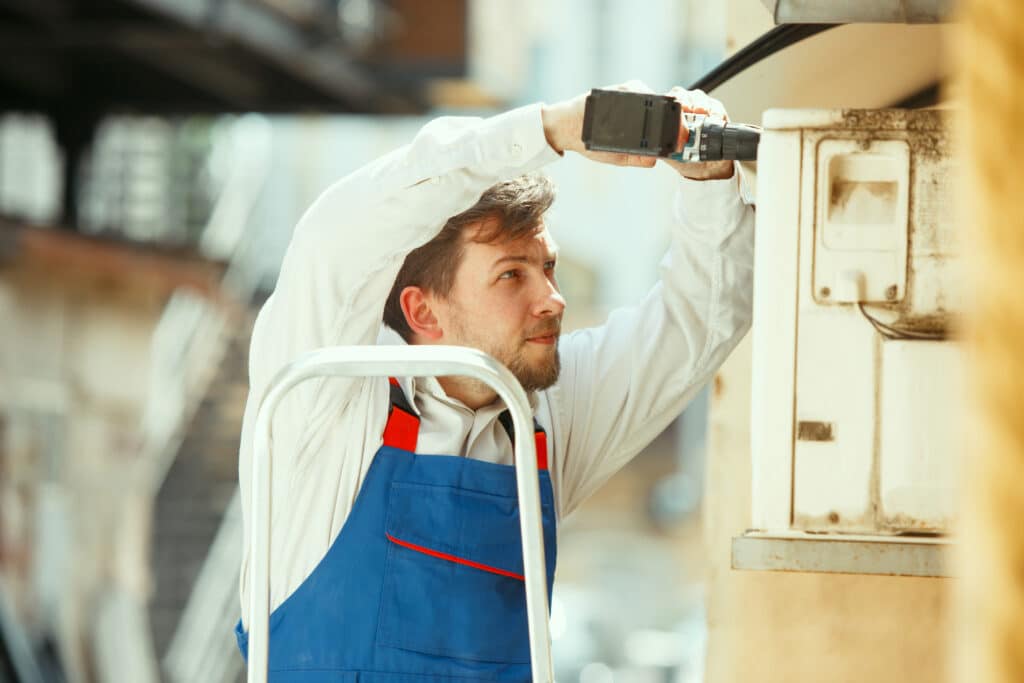 hvac-technician-working-on-a-capacitor-part-for-condensing-unit